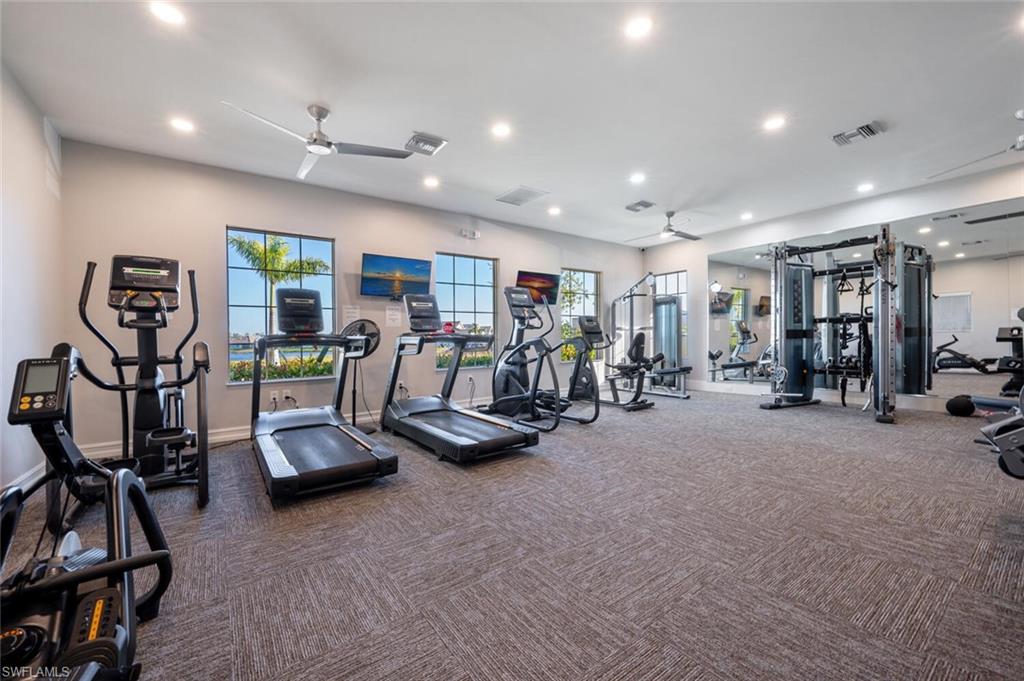 1066 Enbrook Loop Naples, FL 34114 - Photo 9 of 14 a view of a room with gym equipment