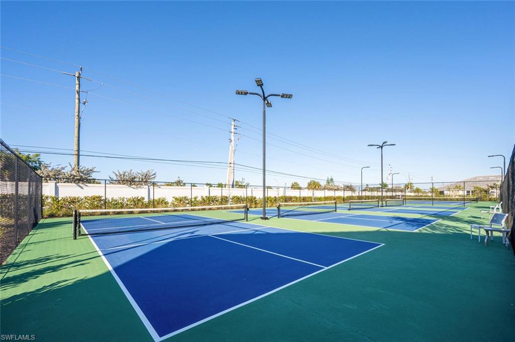 1066 Enbrook Loop Naples, FL 34114 - Photo 10 of 14 a view of a tennis court