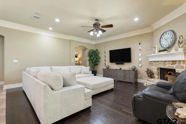 a kitchen with granite countertop white cabinets and stainless steel appliances