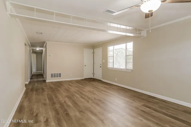 a view of an empty room with a window