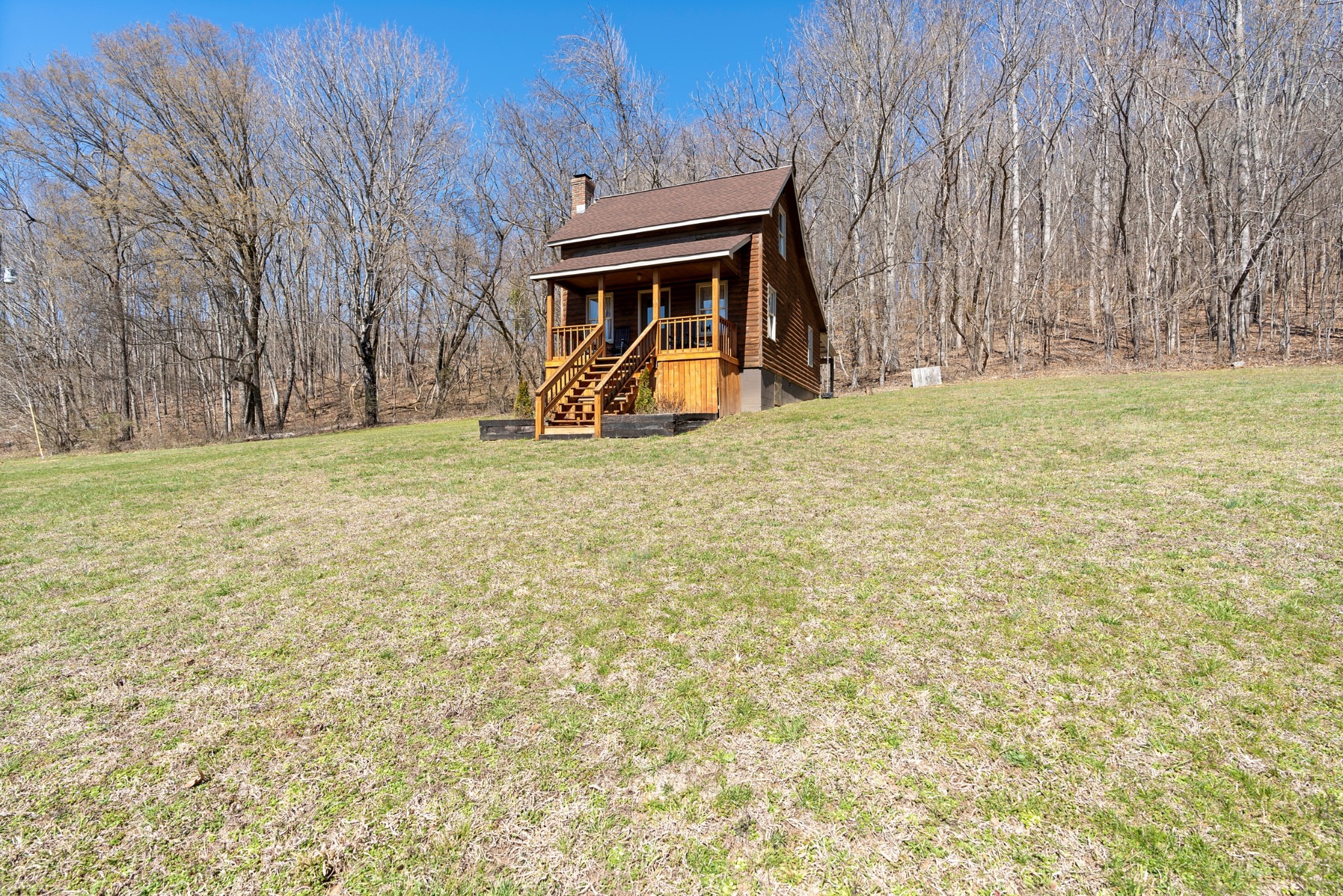 651 Liberty Circle Prospect, TN 38477 - Photo 1 of 24 a house with trees in front of it
