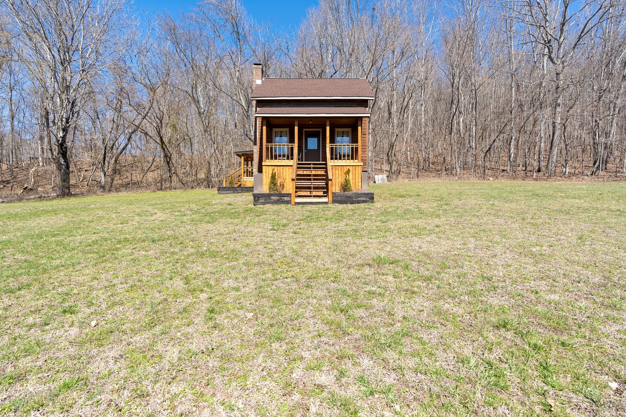 651 Liberty Circle Prospect, TN 38477 - Photo 2 of 24 a house with trees in front of it