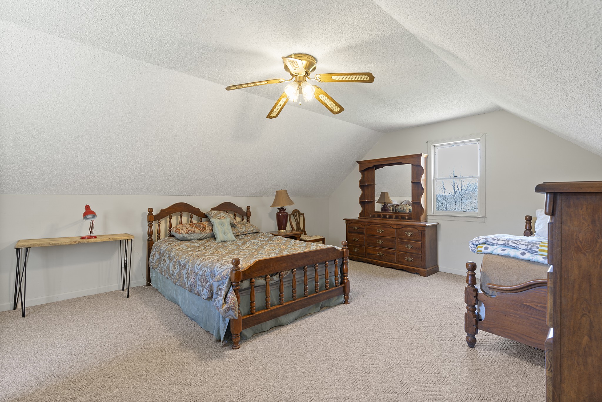 651 Liberty Circle Prospect, TN 38477 - Photo 9 of 24 a bedroom with a bed and a chandelier
