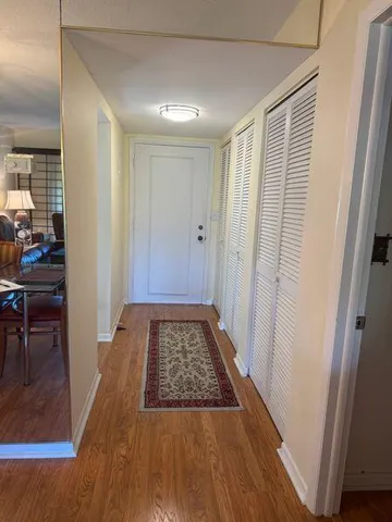 a bathroom with a sink mirror and toilet