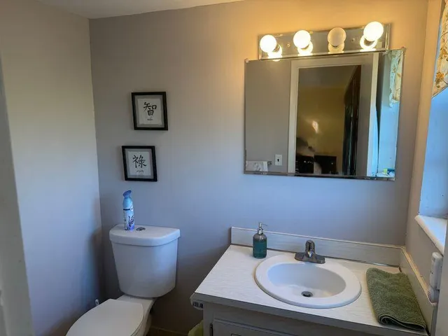 a room with furniture and a floor to ceiling window