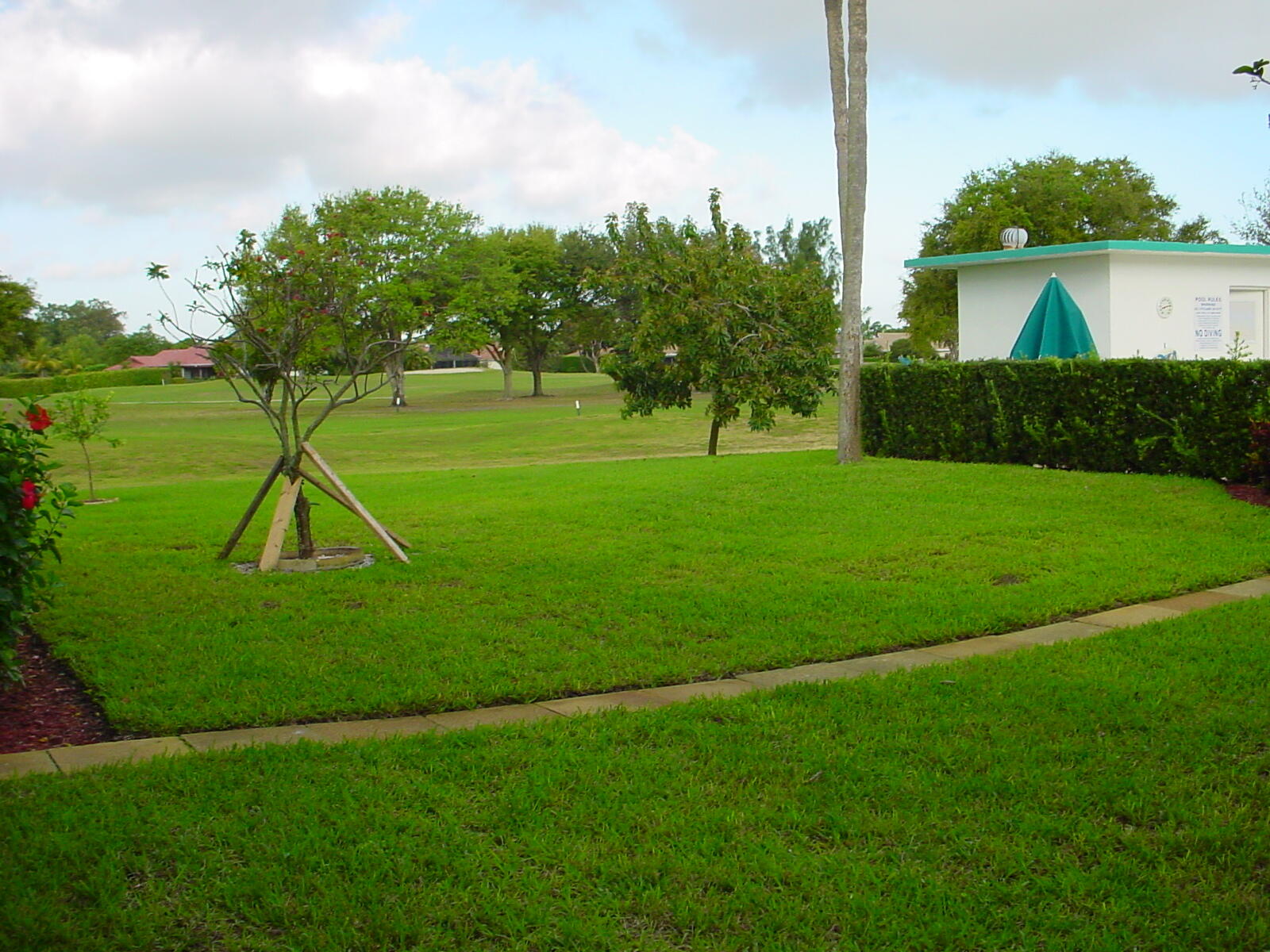 5401 Northwest 2nd Avenue, Unit 224 Boca Raton, FL 33487 - Photo 16 of 18 a view of a playground with a swimming pool