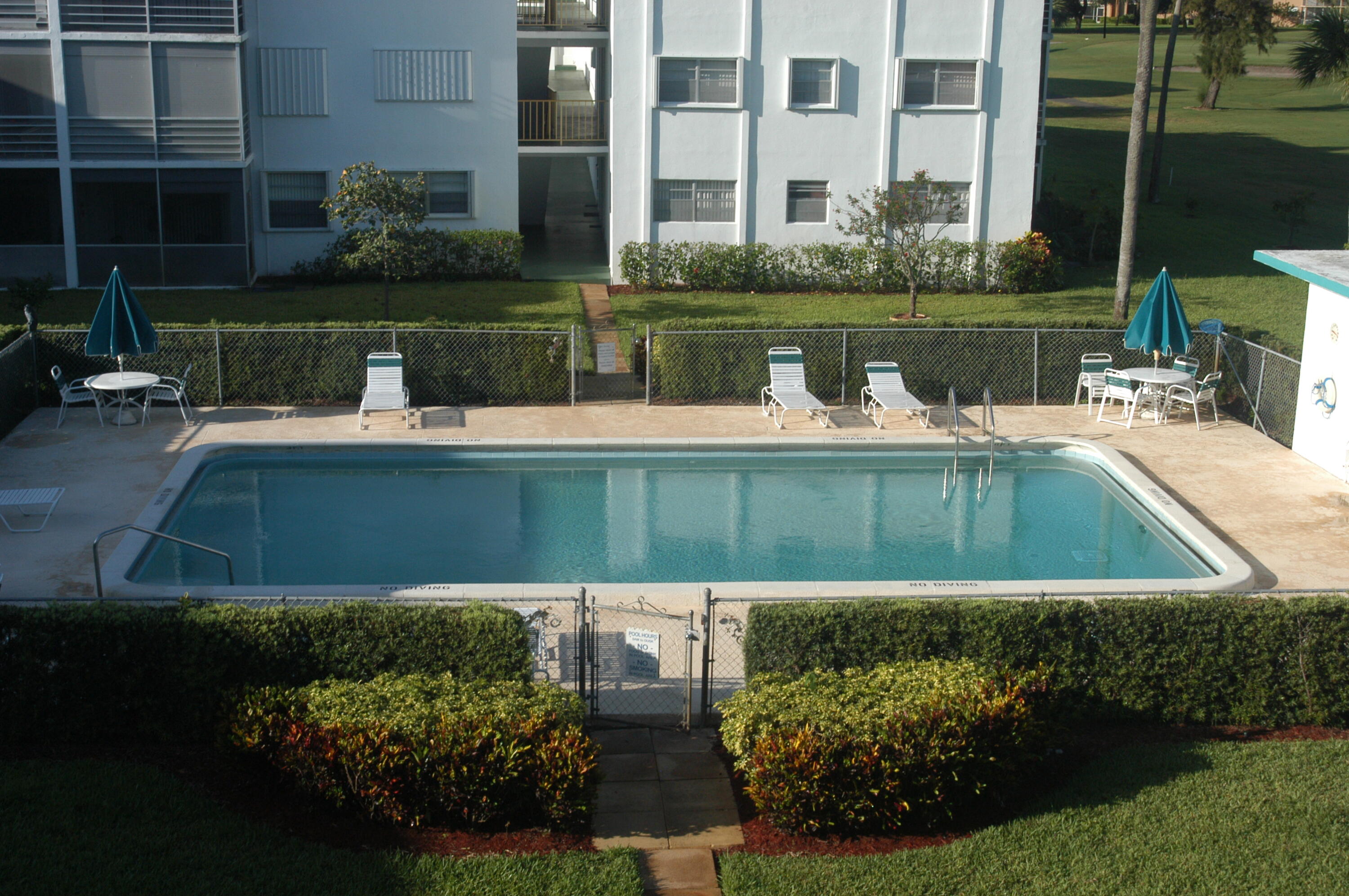 5401 Northwest 2nd Avenue, Unit 224 Boca Raton, FL 33487 - Photo 17 of 18 a view of a house with a swimming pool
