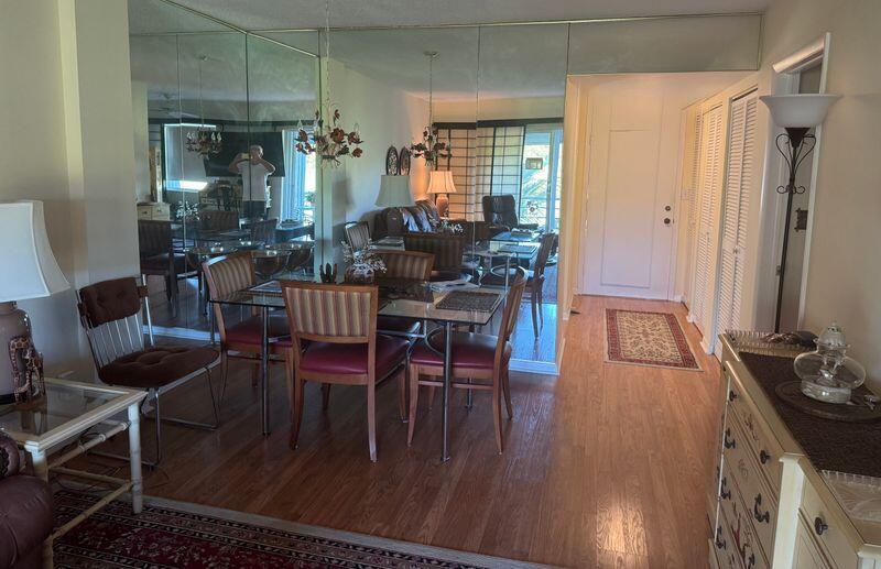 5401 Northwest 2nd Avenue, Unit 224 Boca Raton, FL 33487 - Photo 4 of 18 a dining room with furniture and wooden floor