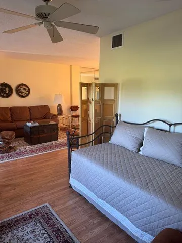 a bedroom with a bed and dresser