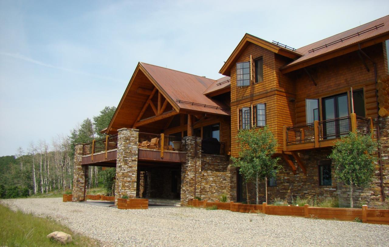 1090 Hull Ridge Road Montrose, CO 81403 - Photo 1 of 9 a front view of a house with garden
