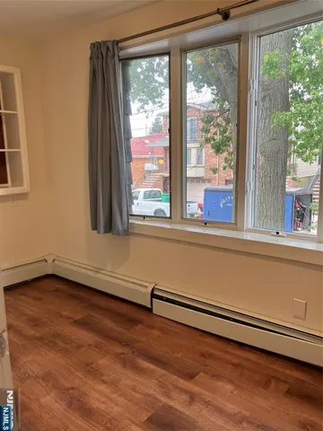 a view of a room with a large window