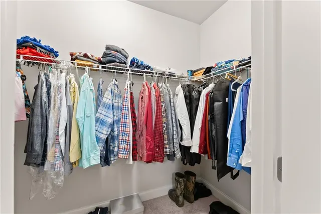 a bathroom with a granite countertop tub sink a shower and a bathtub