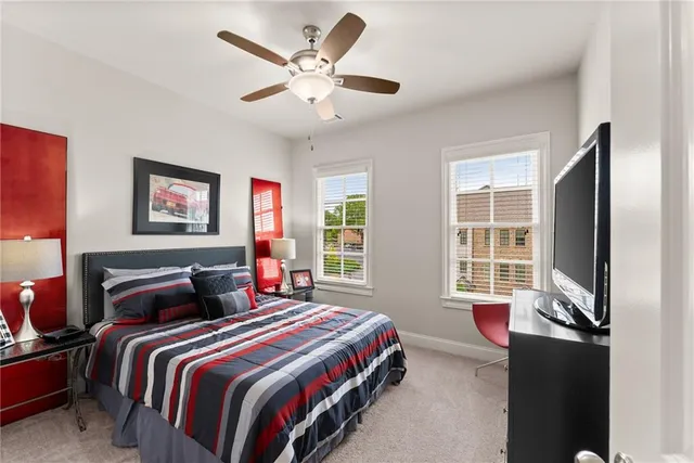 a room with a bed and a flat screen tv