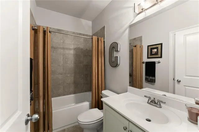 a view of a workspace with furniture and gym equipment