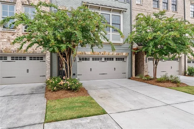 a view of multiple houses with yard