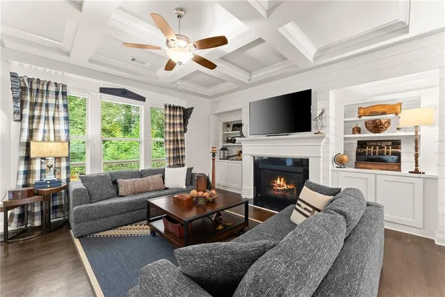 a living room with furniture fireplace and a flat screen tv