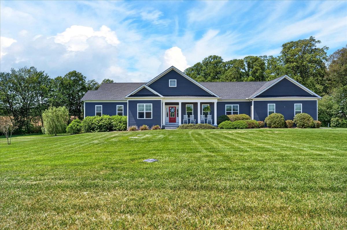 319 Wheatleys Pond Road Clayton, DE 19938 - Photo 1 of 1 a front view of a house with a yard