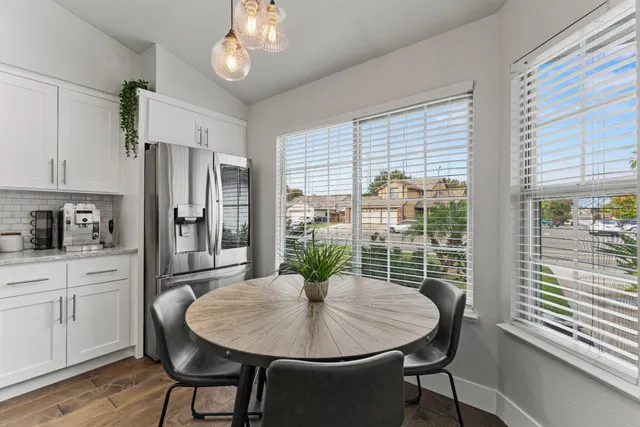 a view of a dining room with furniture window and wooden floor