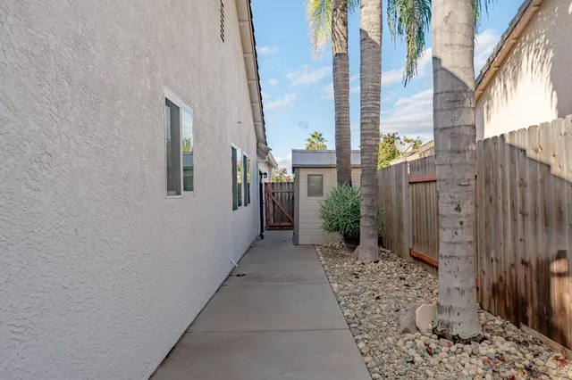 a view of a pathway along with potted plants