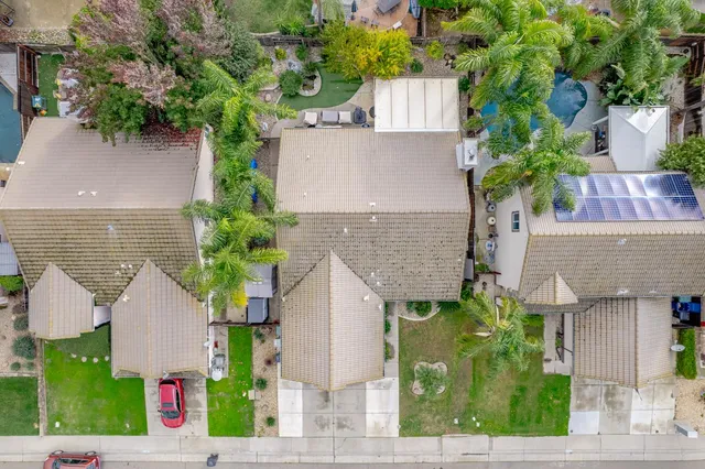 front view of house with potted plants