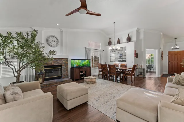 a living room with furniture fireplace and window