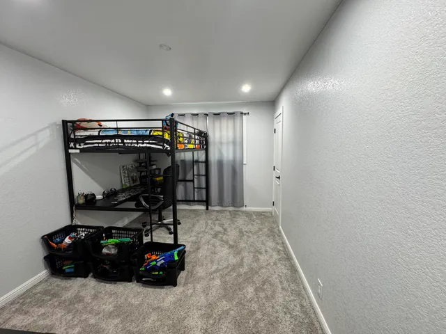 a room with gym equipment and a mirror