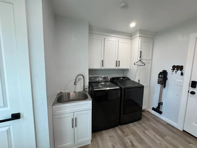 a kitchen with a refrigerator and a stove