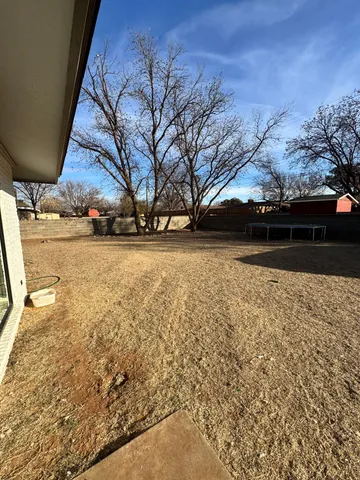 a view of a house with a snow in the yard