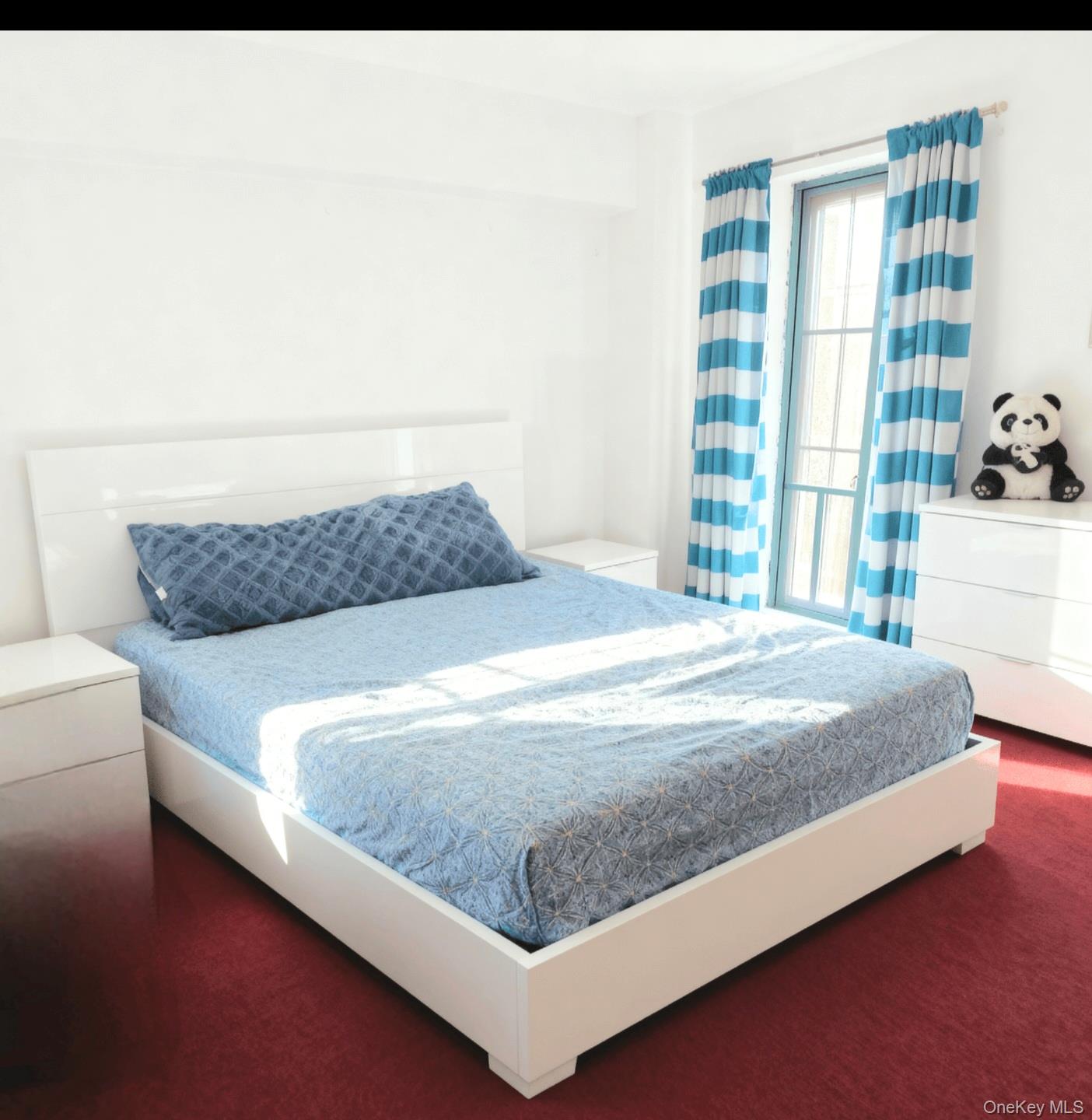 249 Calhoun Avenue Bronx, NY 10465 - Photo 4 of 11 a bed sitting in a bedroom next to a window