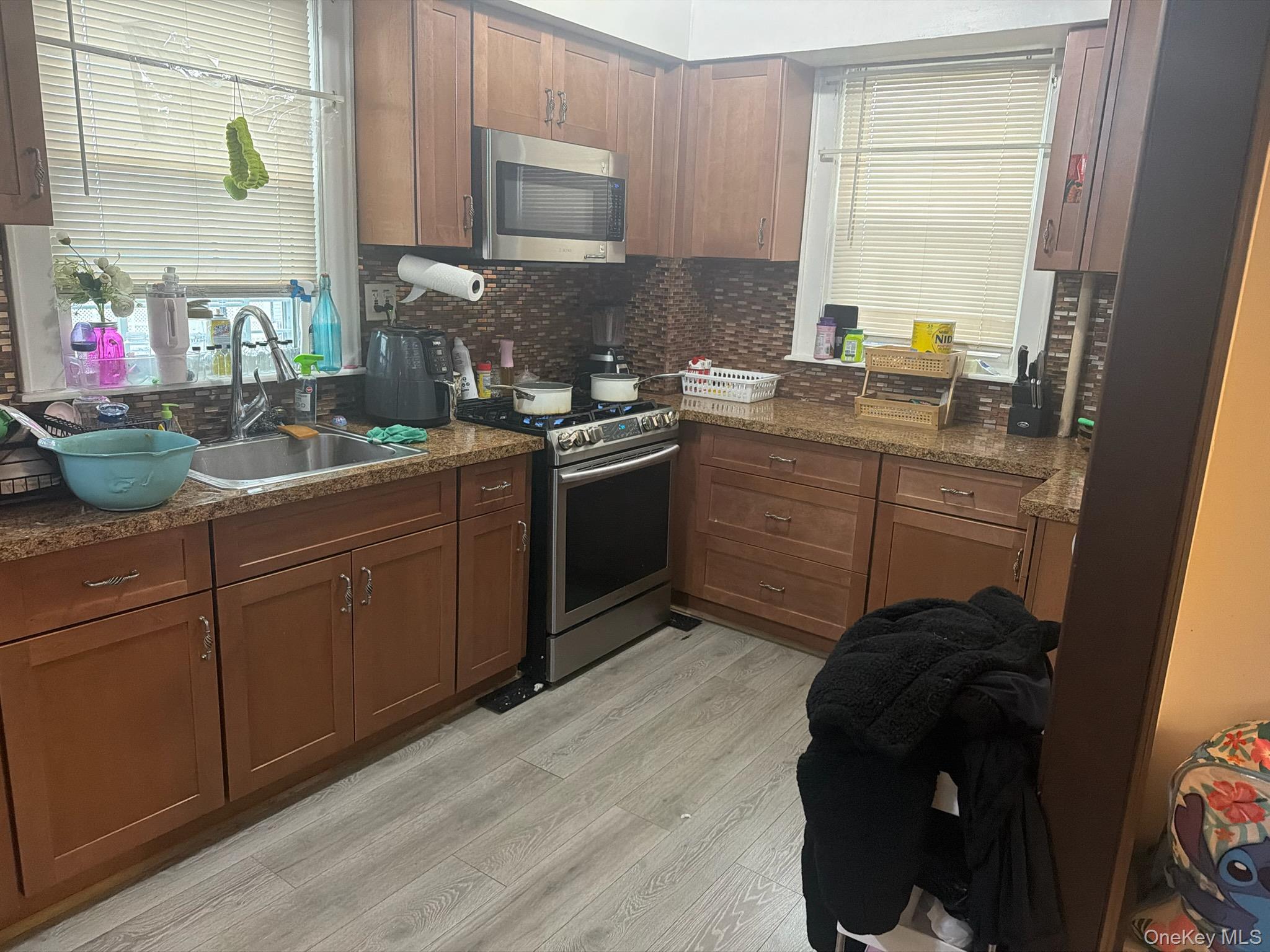 249 Calhoun Avenue Bronx, NY 10465 - Photo 7 of 11 a kitchen with a sink and cabinets