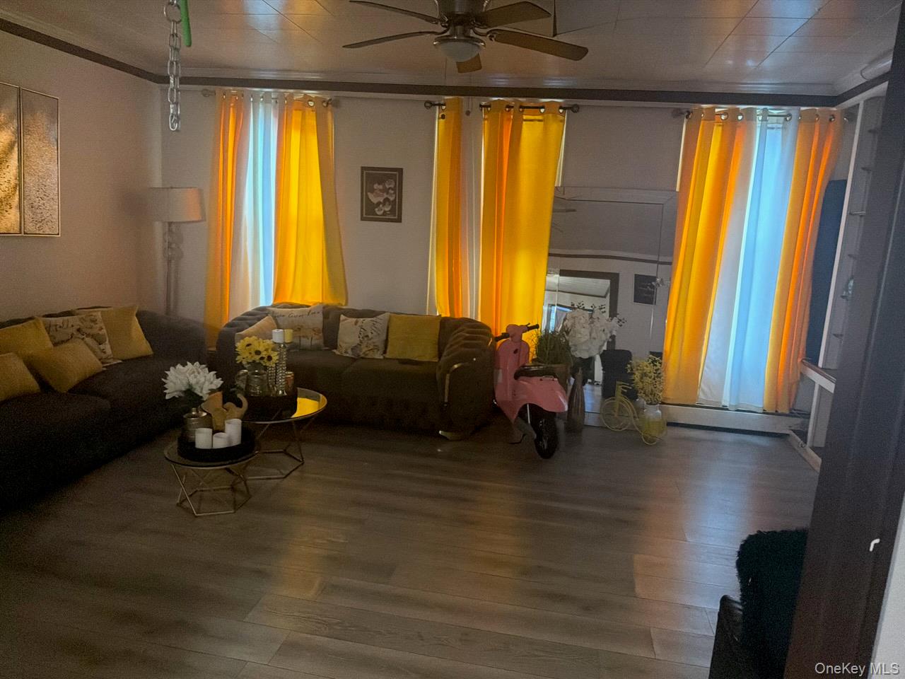 249 Calhoun Avenue Bronx, NY 10465 - Photo 7 of 15 Living area with wood finished floors and a ceiling fan