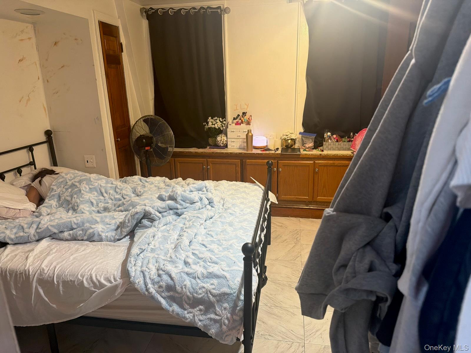 249 Calhoun Avenue Bronx, NY 10465 - Photo 10 of 11 a bed sitting in a bedroom next to a window