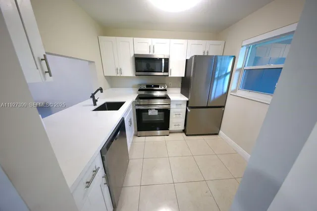 a living room with furniture and chandelier