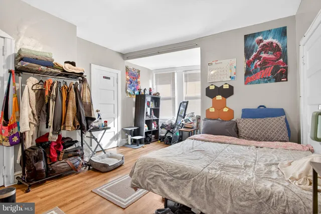 a bed room with a bed and a walk in closet