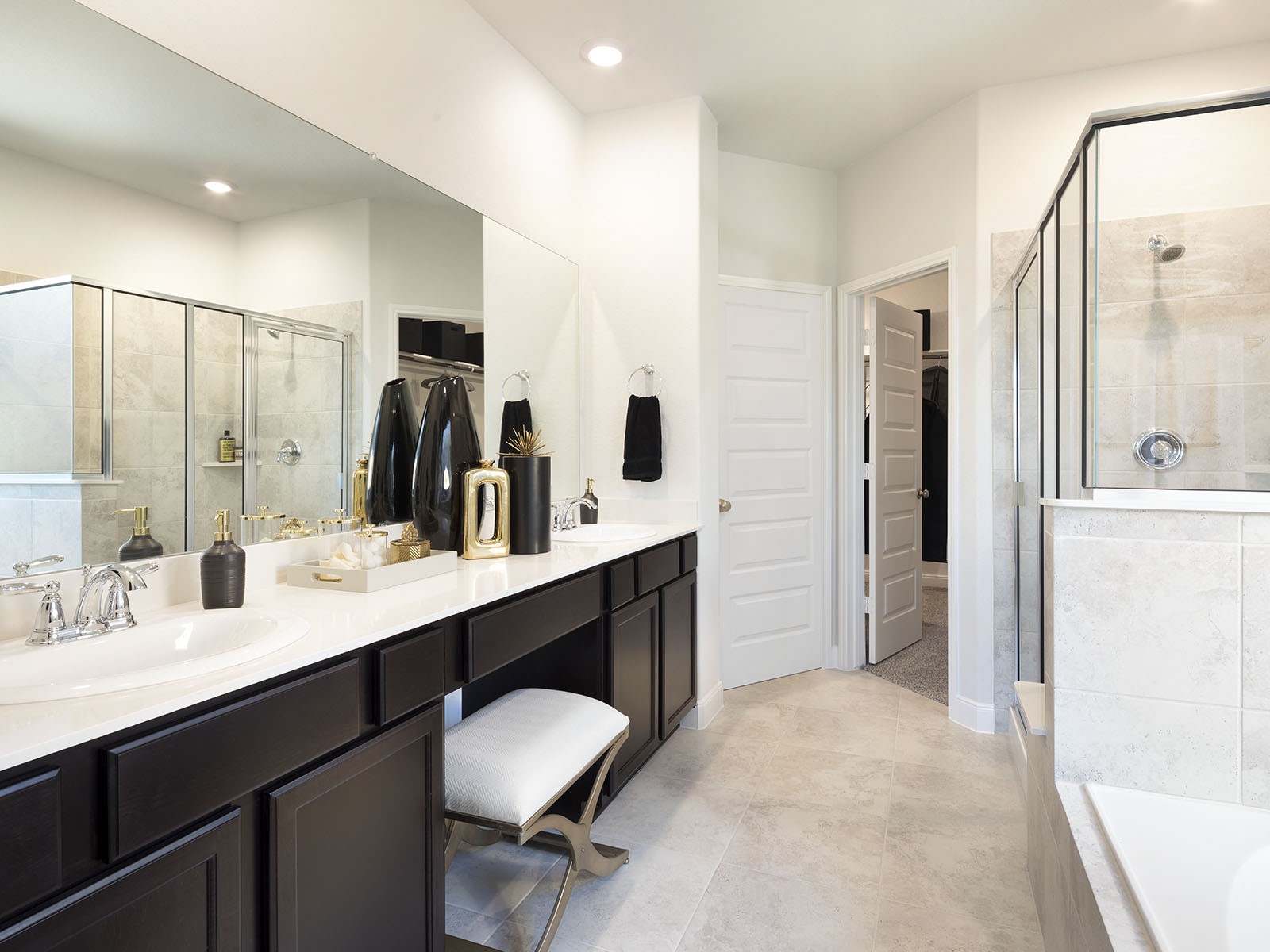 17902 Stone Terrace Montgomery, TX 77316 - Photo 7 of 13 a bathroom with a double vanity sink a toilet a mirror and shower