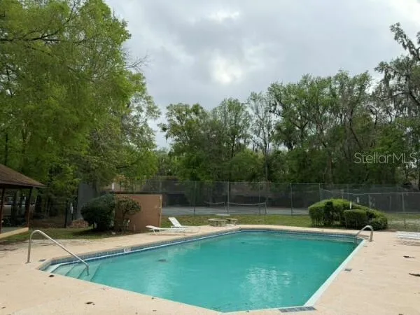 a view of a swimming pool with a patio