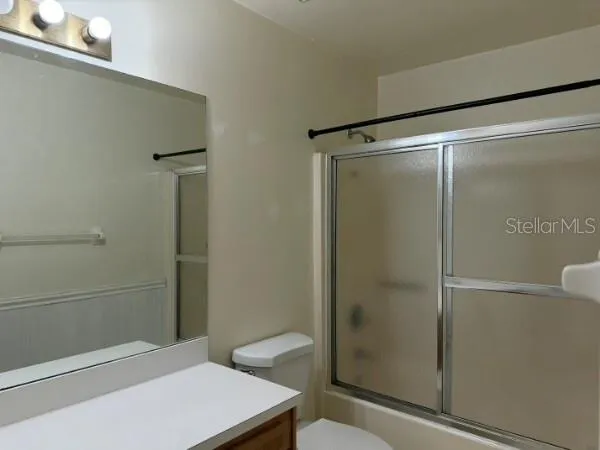 a bathroom with a shower and a toilet
