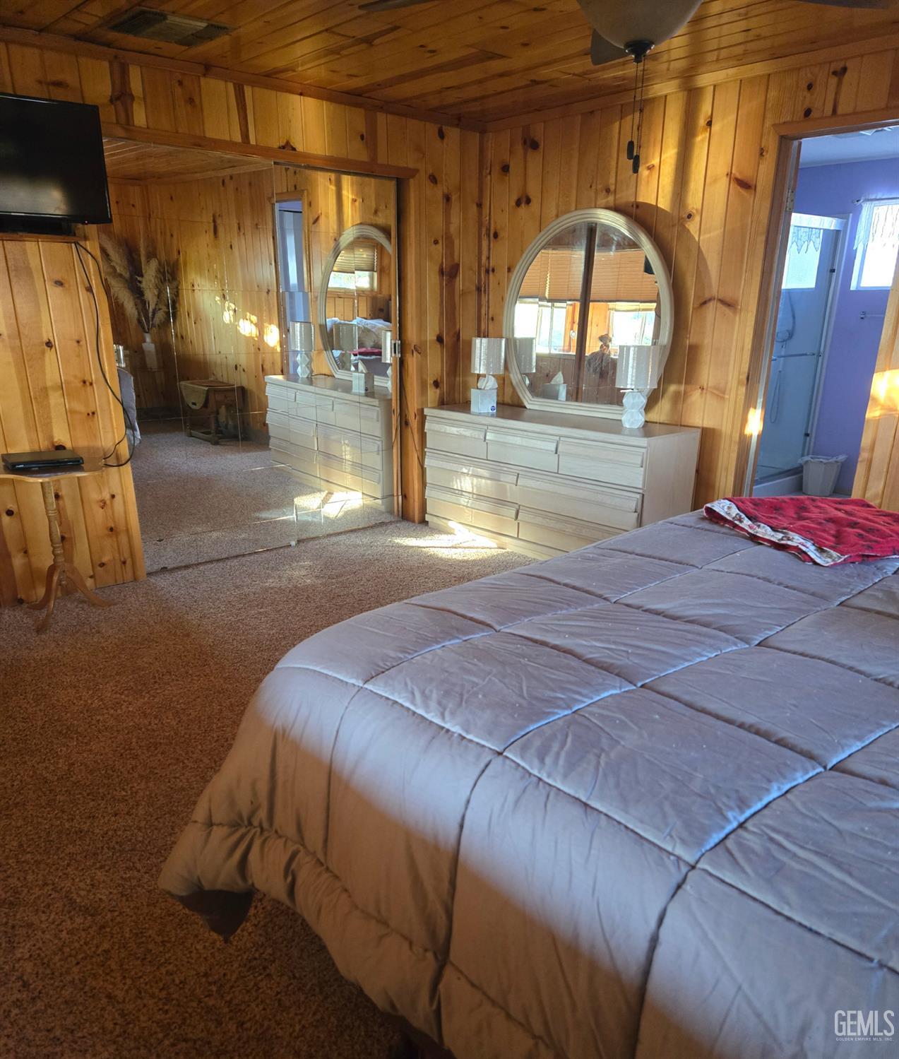 Undisclosed Address Caliente, CA 93518 - Photo 15 of 33 a bedroom with a bed and a large mirror