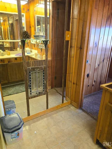 a bathroom with a sink toilet and mirror