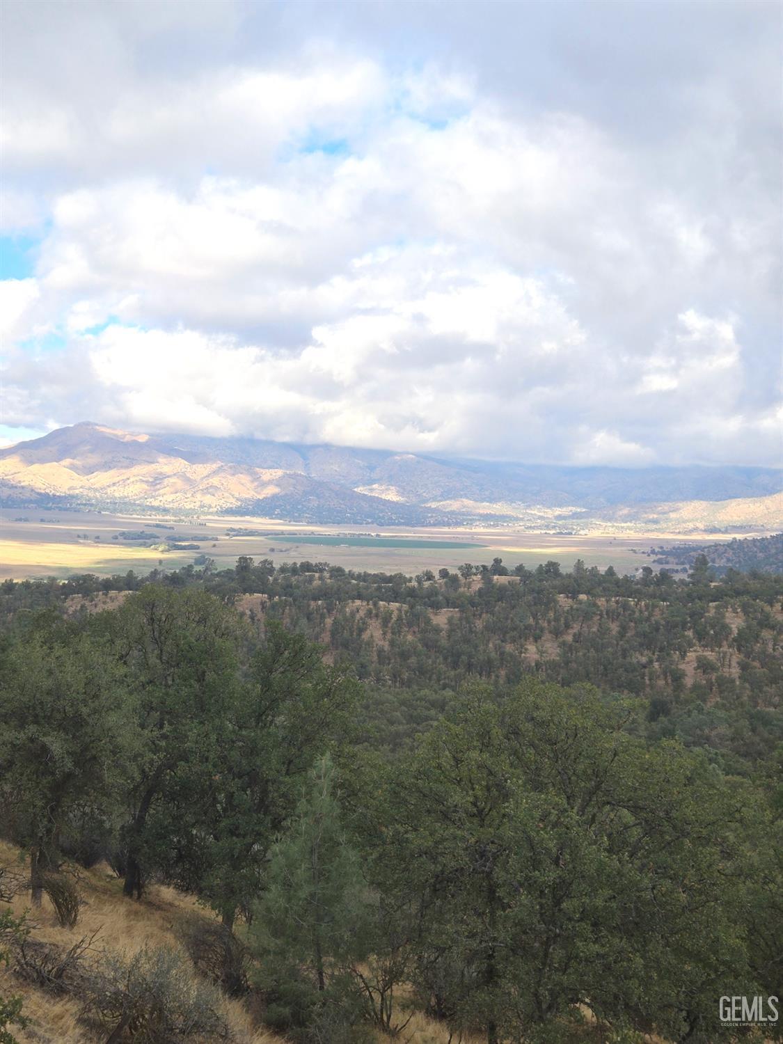 Undisclosed Address Caliente, CA 93518 - Photo 28 of 33 a view of a city with lush green forest
