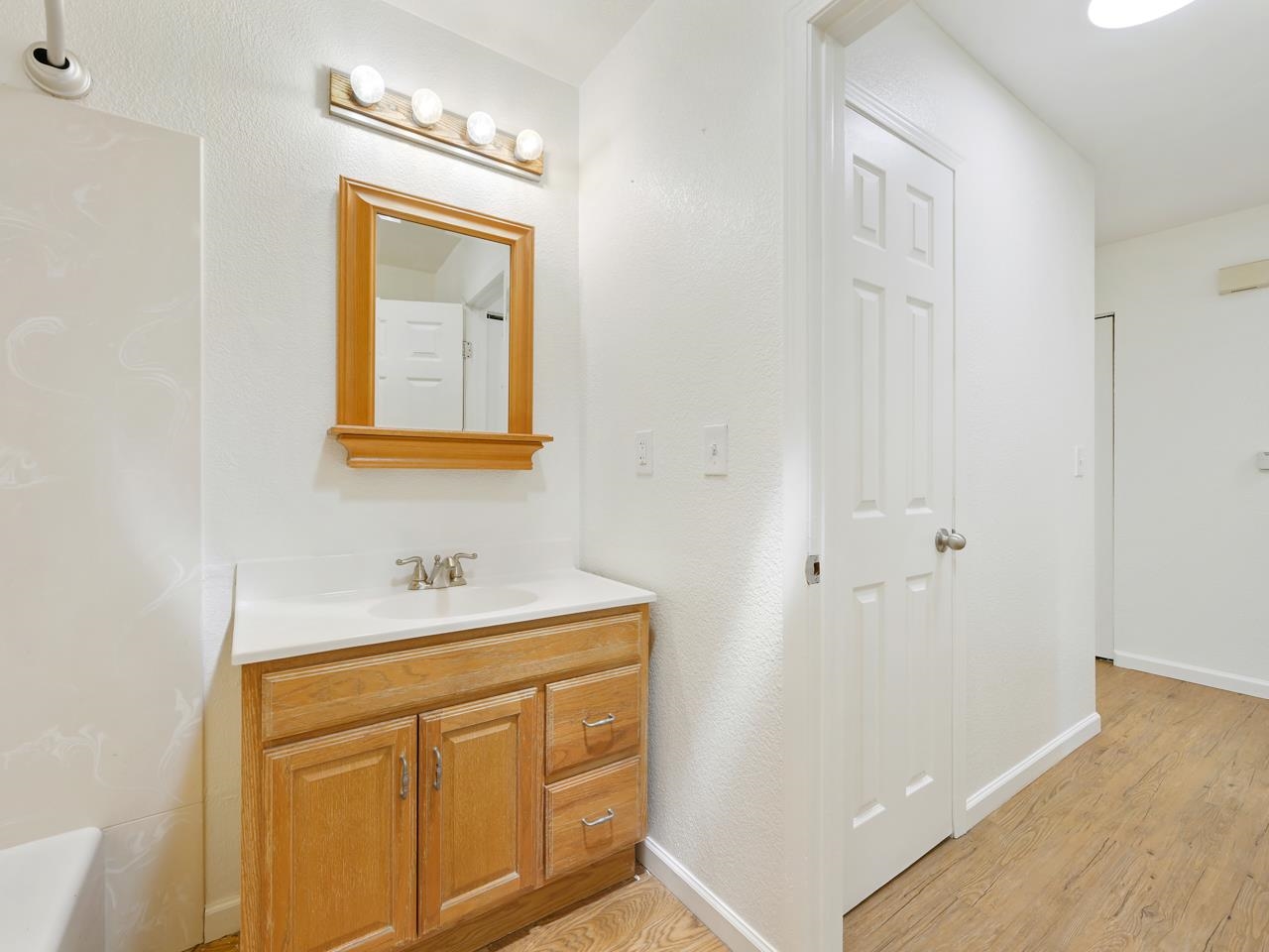 160 Sunset Drive Fruita, CO 81521 - Photo 13 of 22 a bathroom with a sink a mirror and vanity