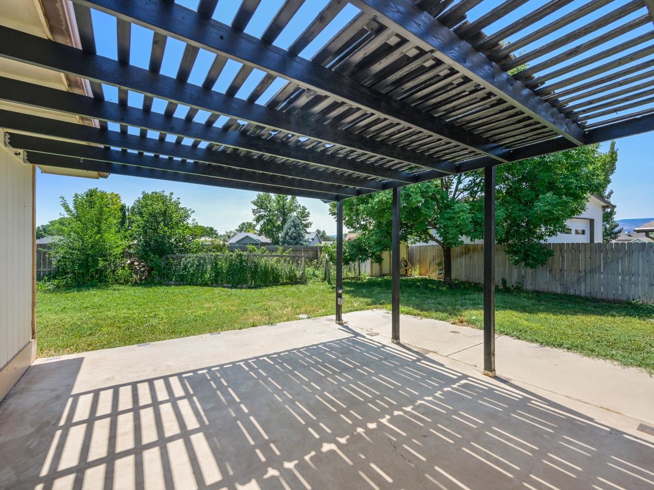 160 Sunset Drive Fruita, CO 81521 - Photo 18 of 22 a view of a porch and garden