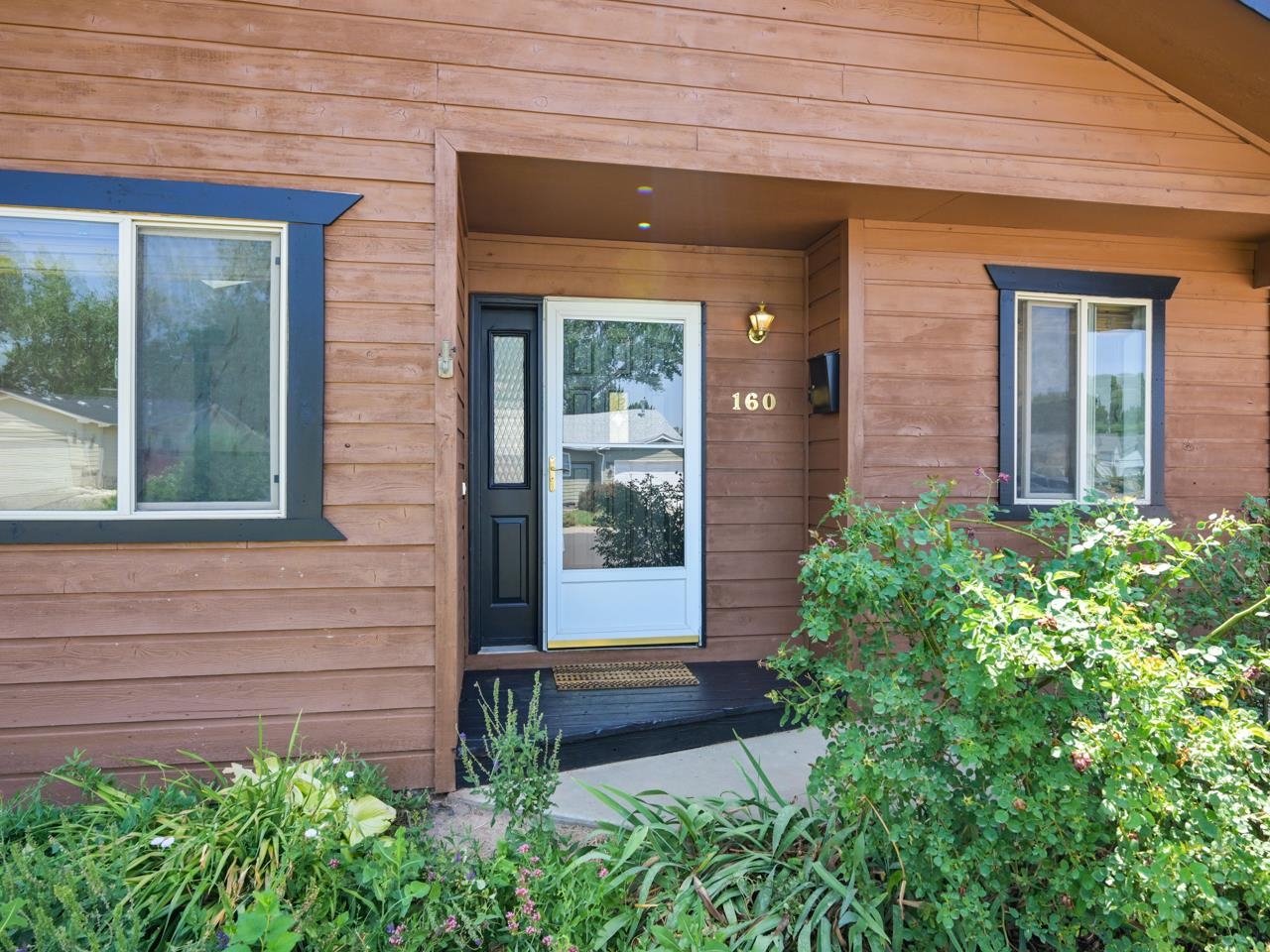 160 Sunset Drive Fruita, CO 81521 - Photo 20 of 22 a front view of a house with a yard
