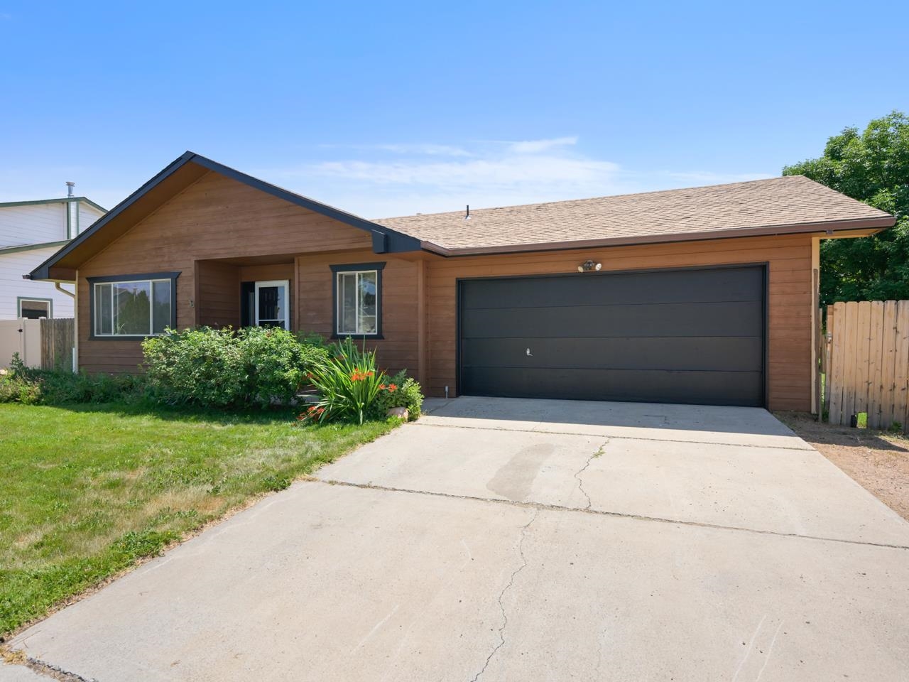 160 Sunset Drive Fruita, CO 81521 - Photo 21 of 22 a front view of house with yard and trees around