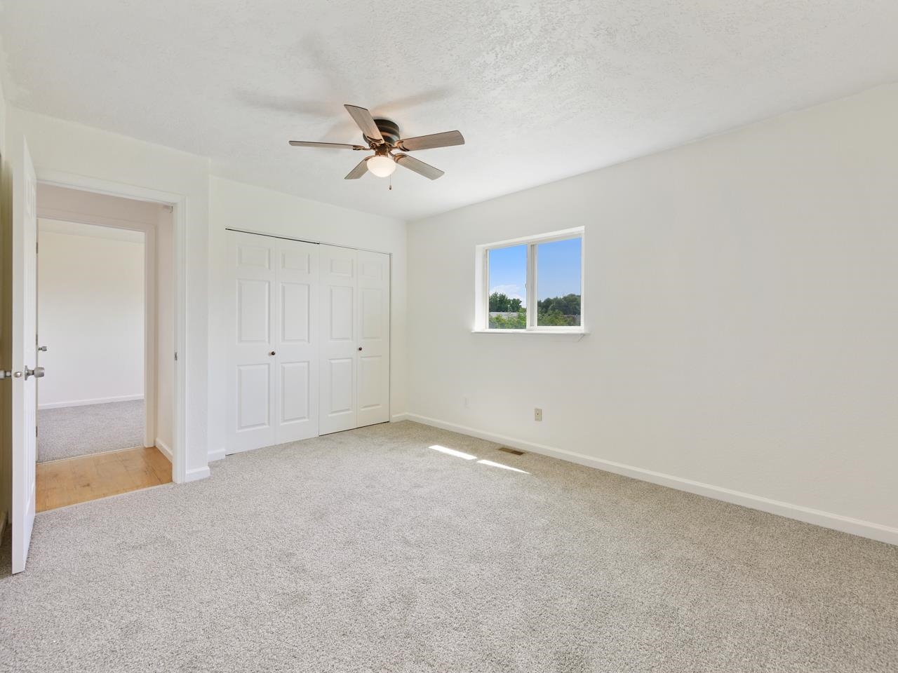 160 Sunset Drive Fruita, CO 81521 - Photo 8 of 22 a view of an empty room with a window