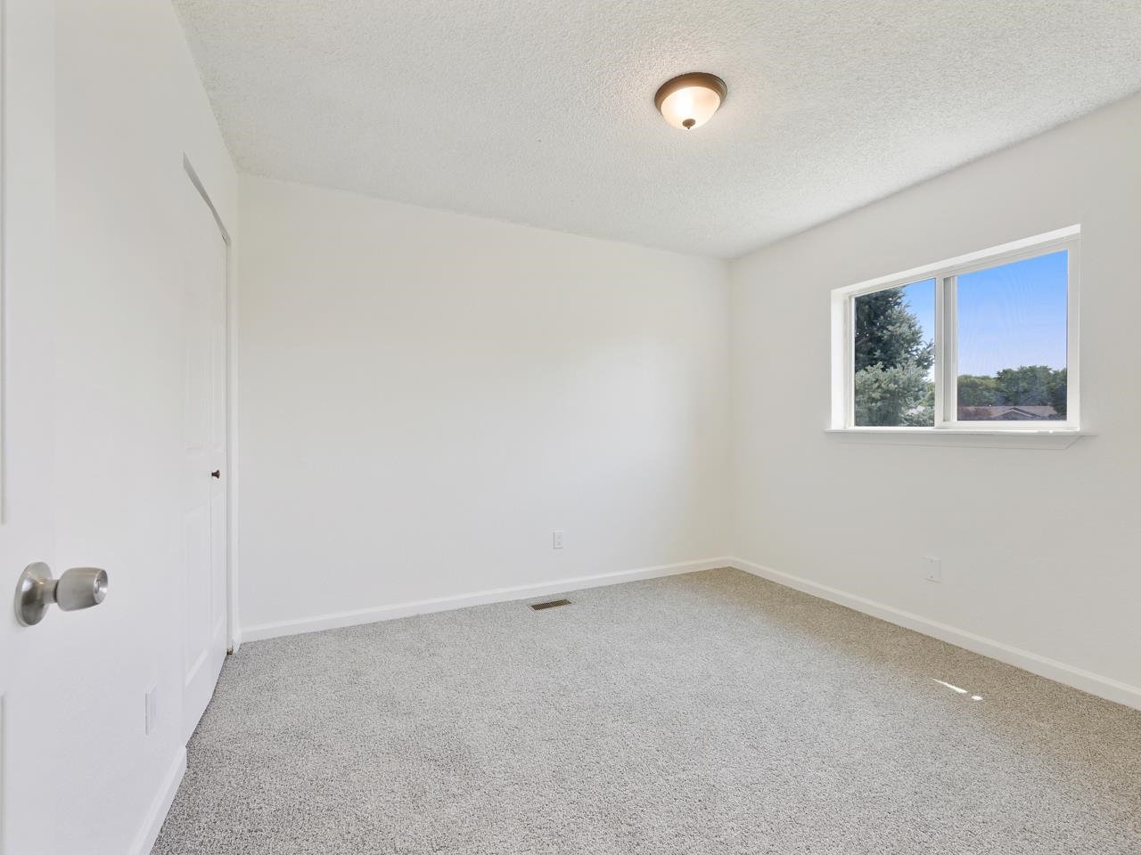 160 Sunset Drive Fruita, CO 81521 - Photo 10 of 22 an empty room with a window