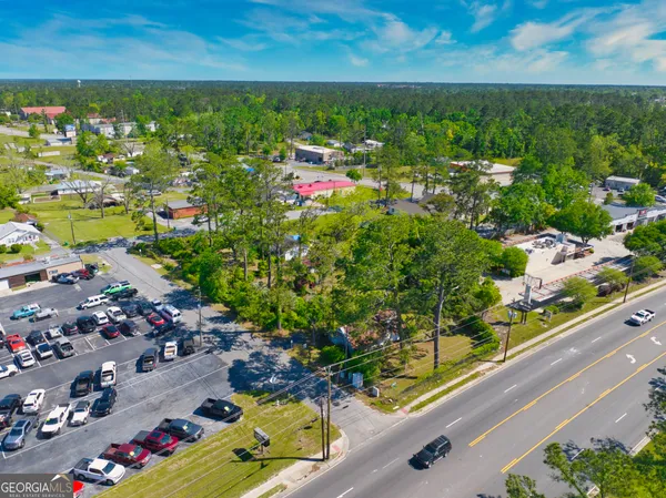 an aerial view of residential houses and outdoor space