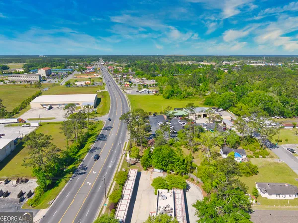 a view of house with yard