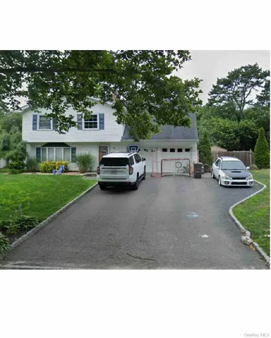 a view of a city that has parked cars