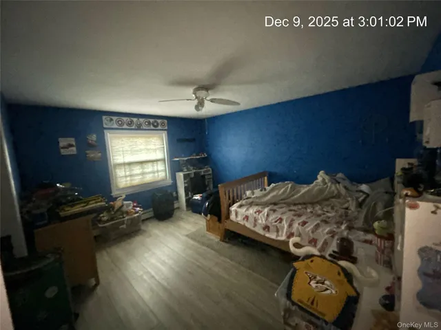 a bedroom with bed and a window